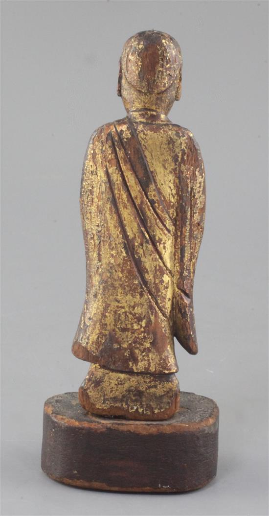 A Chinese giltwood figure of a Luohan, Ming dynasty or earlier, height 21.5cm